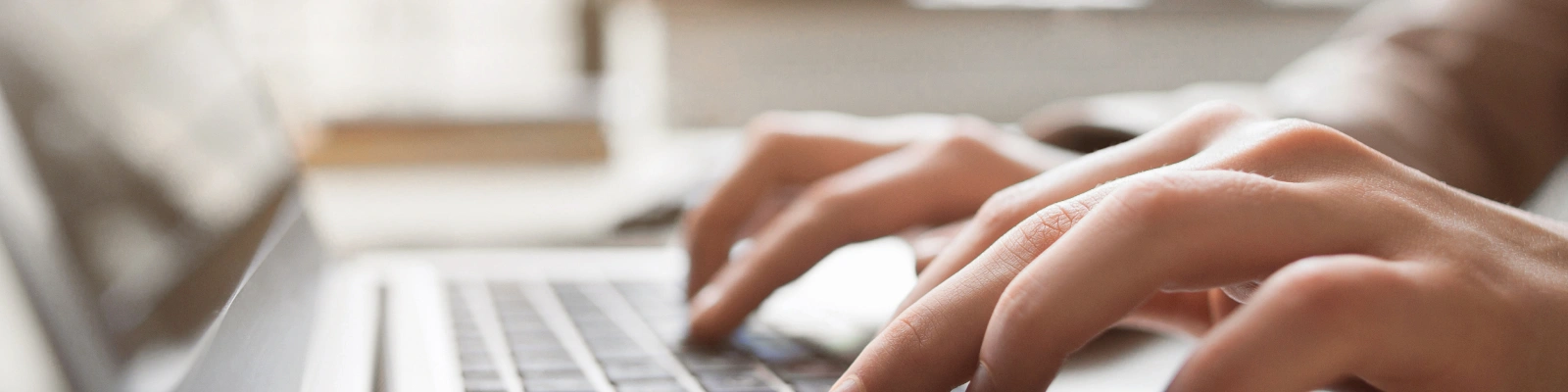 person typing on a laptop